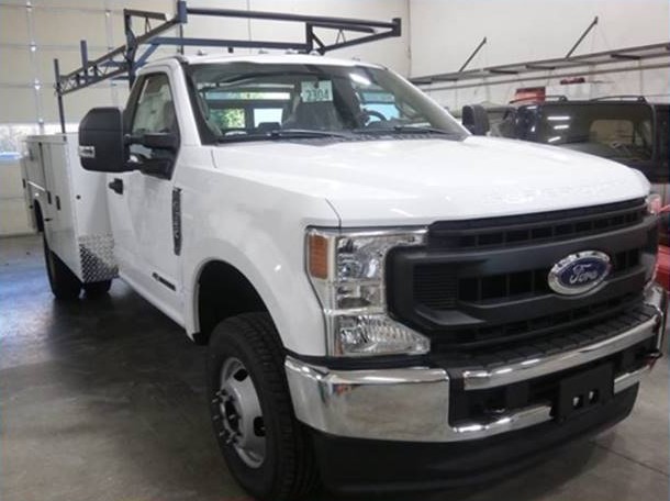 Ford white color truck standing in a garage